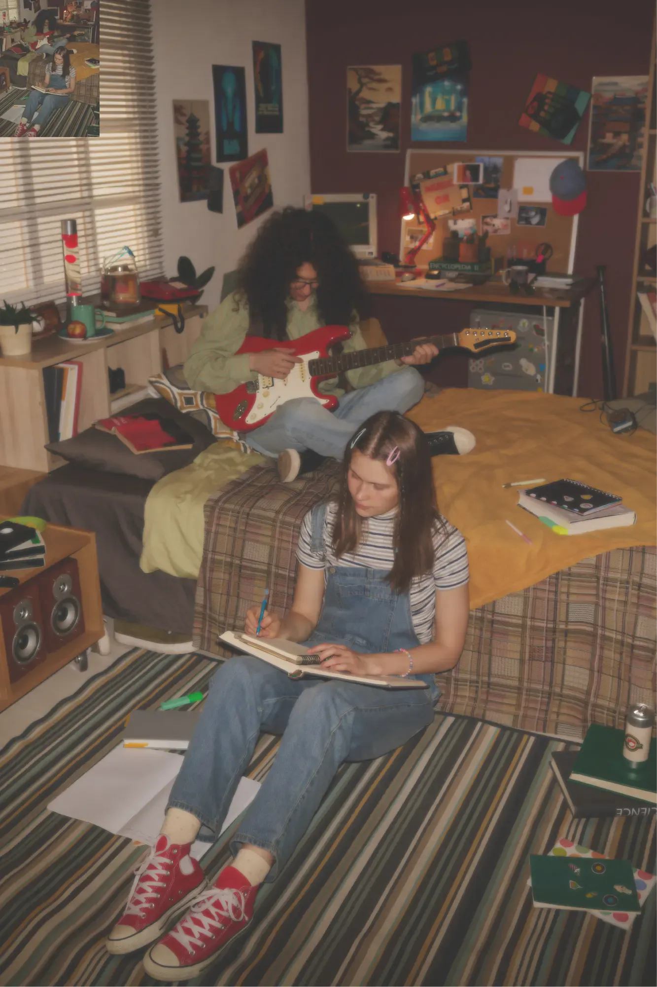 Two artists writing music in a bedroom studio